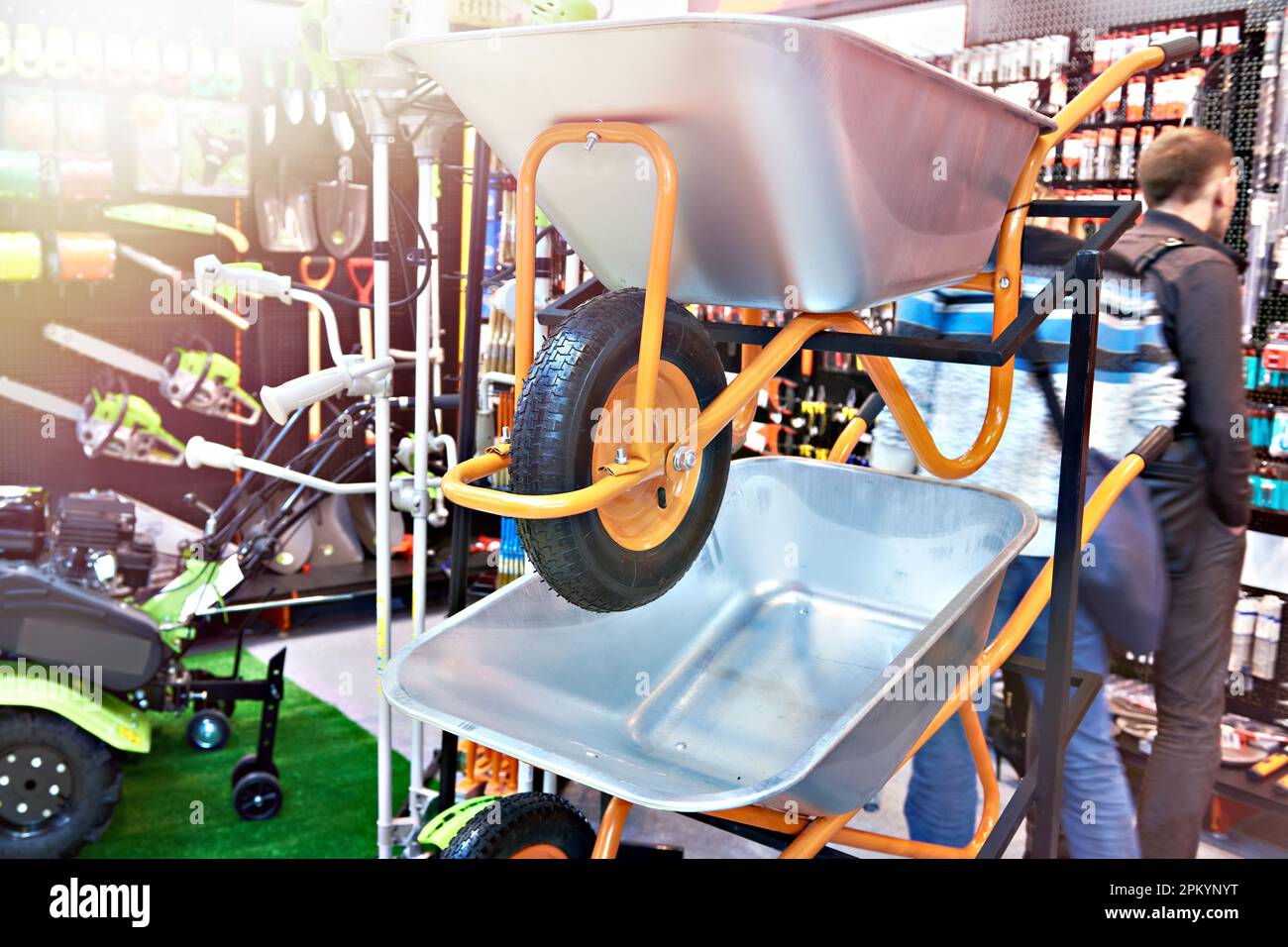 Garden wheelbarrows and tools in hardware store Stock Photo Alamy