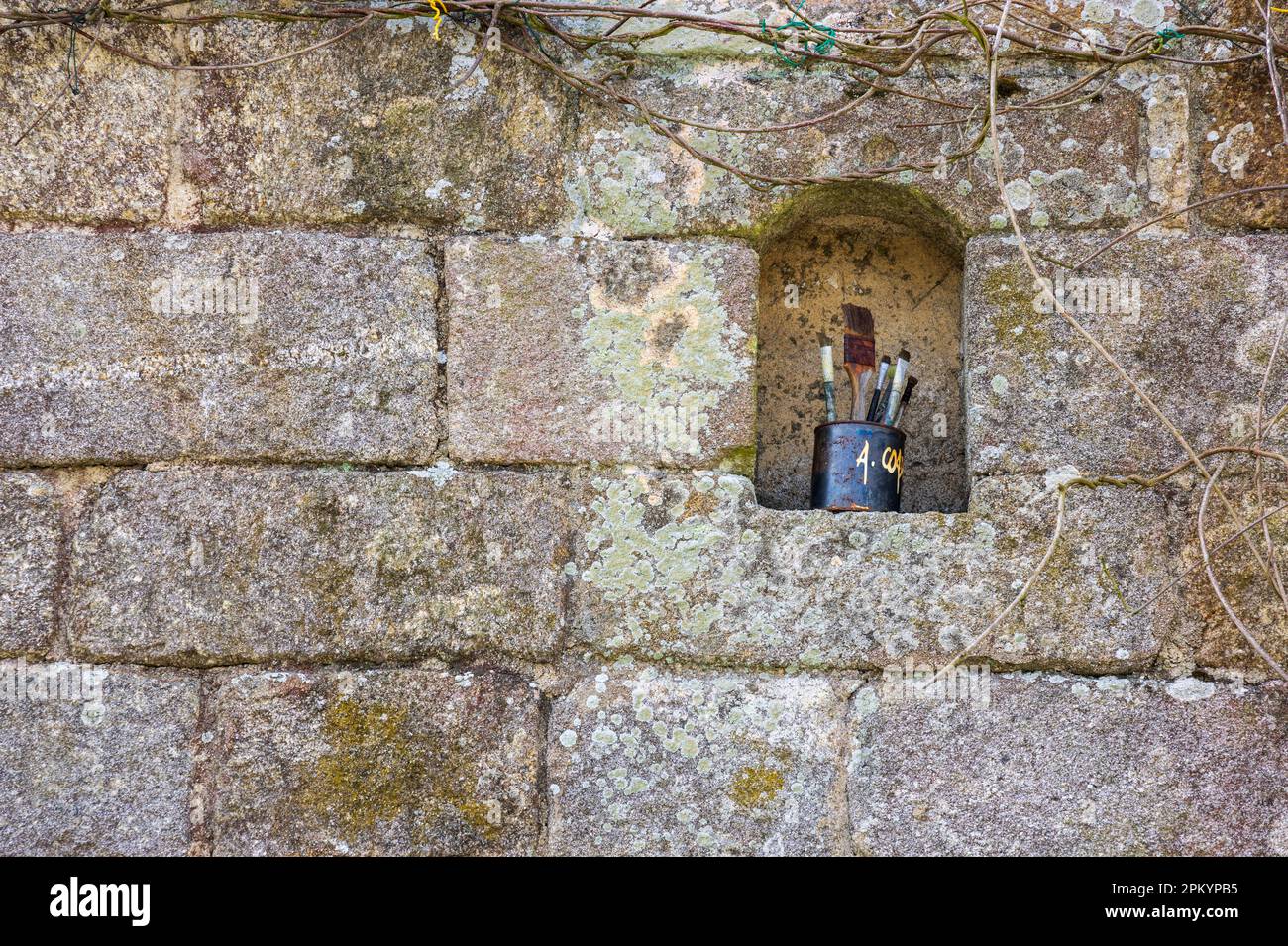 Paint brushes in an alcove above an artists shop in Locronan, Brittany