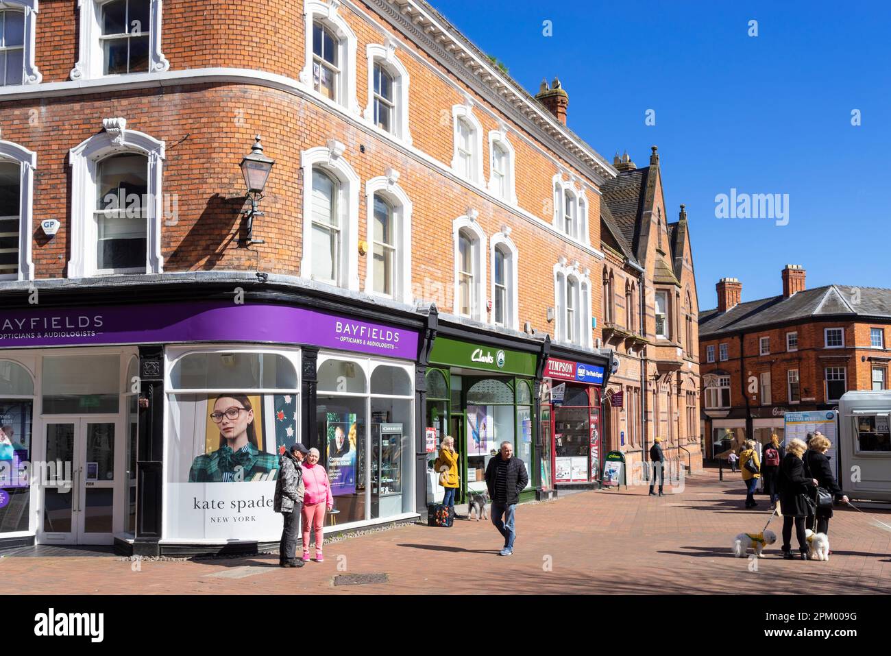 Nantwich Cheshire East - Nantwich high street Bayfields at Pinnington Opticians with people shopping in the town square Nantwich Cheshire England UK Stock Photo