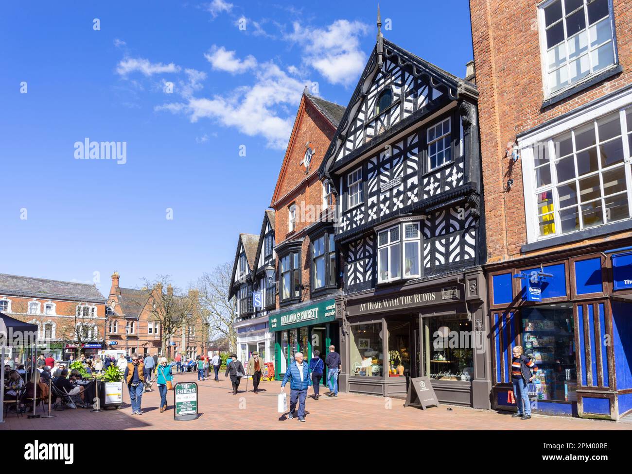 Nantwich Cheshire East - Nantwich high street with half timbered buildings and people shopping Nantwich Cheshire England UK GB Europe Stock Photo