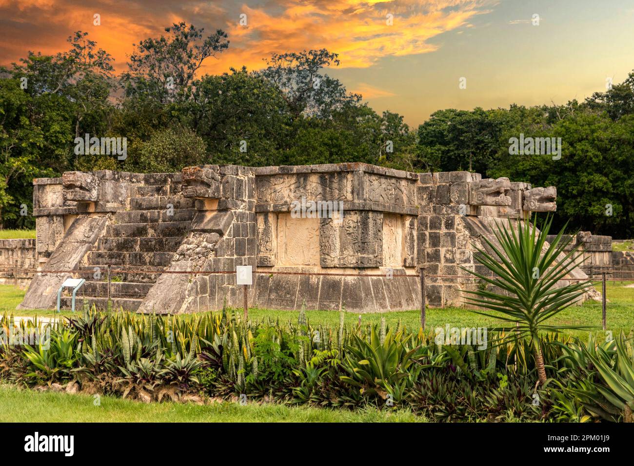 God Kukulkan on the platform of eagles and jaguars under a beautiful orange sunset, this is the feathered serpent of the Mayan civilization. Concept p Stock Photo