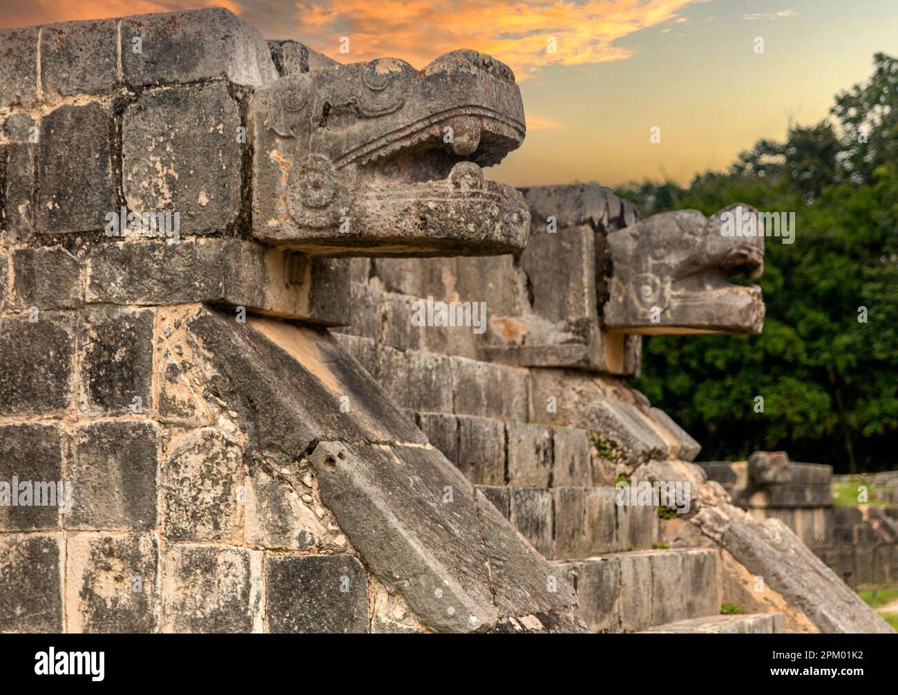 Enjoying the God Kukulkan on the platform of eagles and jaguars under a beautiful orange sunset, this is the feathered serpent of the Mayan civilizati Stock Photo