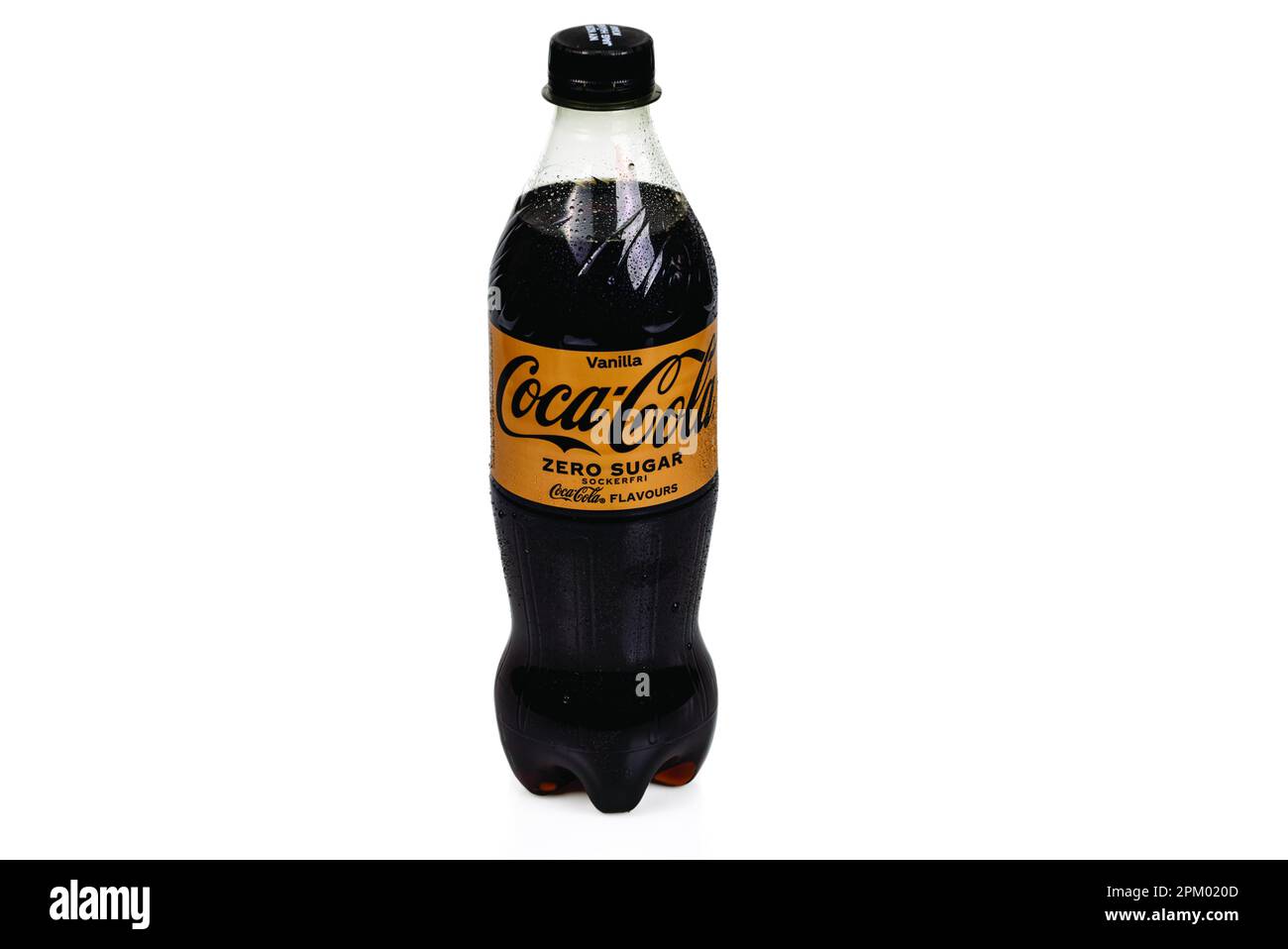 Close-up view of cold plastic sugar-free bottle with vanilla Coca Cola isolated on white background. Stock Photo
