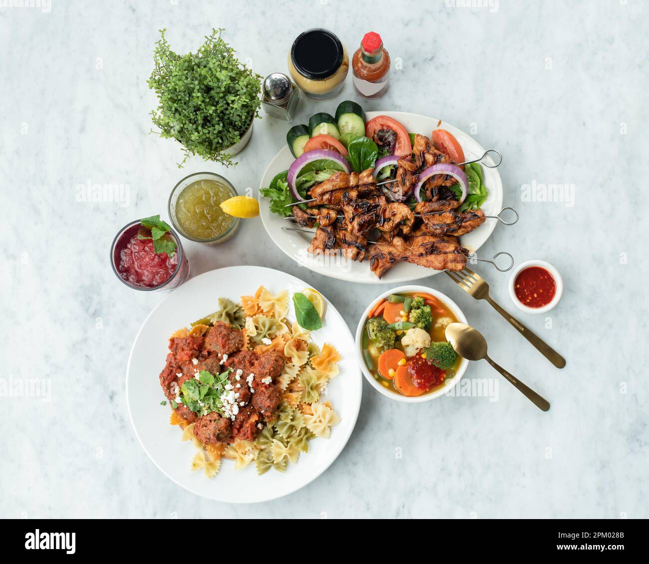 A casual eatery is filled with a variety of fresh food and condiments Stock Photo