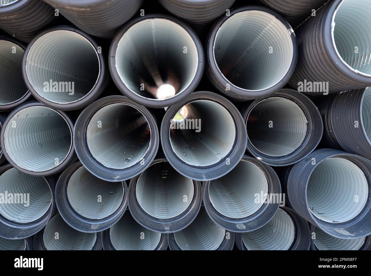 construction pipes stacked on the street Stock Photo