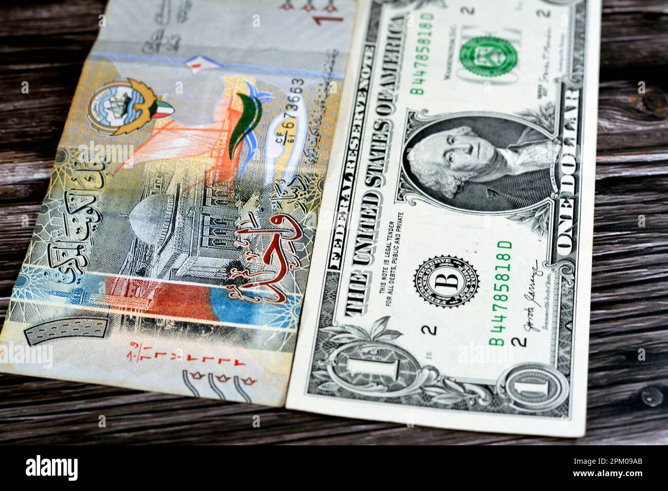 American USA dollar cash money banknote of one dollar bill and Kuwait one dinar note, Kuwaiti money and American currency exchange rate concept, money Stock Photo