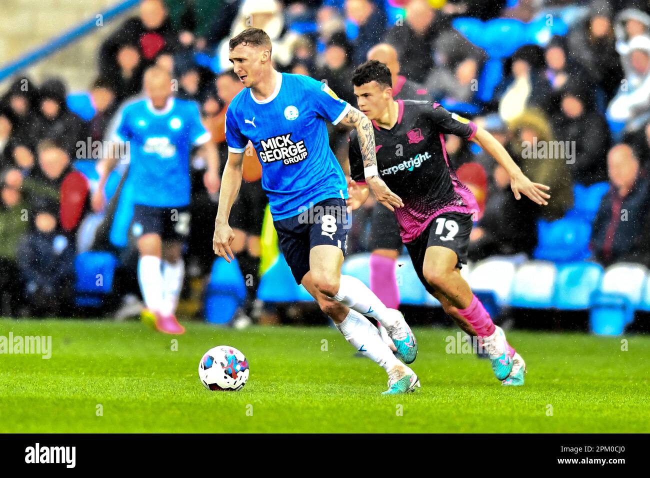 Jack Taylor (8 Peterborough United) challenged by Sonny Cox ( 19 Exeter City) during the Sky Bet League 1 match between Cambridge United and Fleetwood Town at the R Costings Abbey Stadium, Cambridge on Friday 7th April 2023. (Photo: Kevin Hodgson | MI News) Credit: MI News & Sport /Alamy Live News Stock Photo