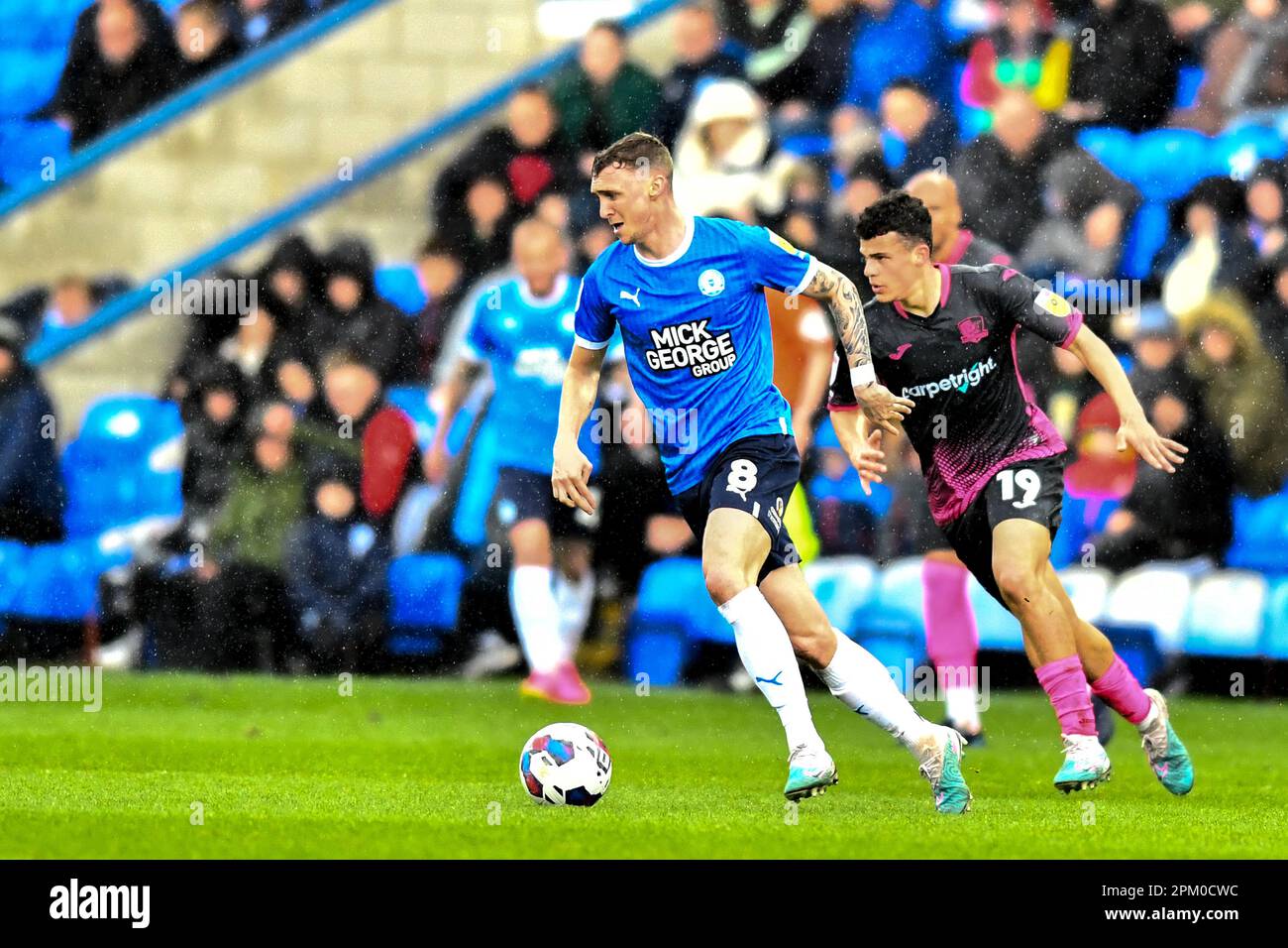 Jack Taylor (8 Peterborough United) challenged by Sonny Cox ( 19 Exeter City during the Sky Bet League 1 match between Cambridge United and Fleetwood Town at the R Costings Abbey Stadium, Cambridge on Friday 7th April 2023. (Photo: Kevin Hodgson | MI News) Credit: MI News & Sport /Alamy Live News Stock Photo