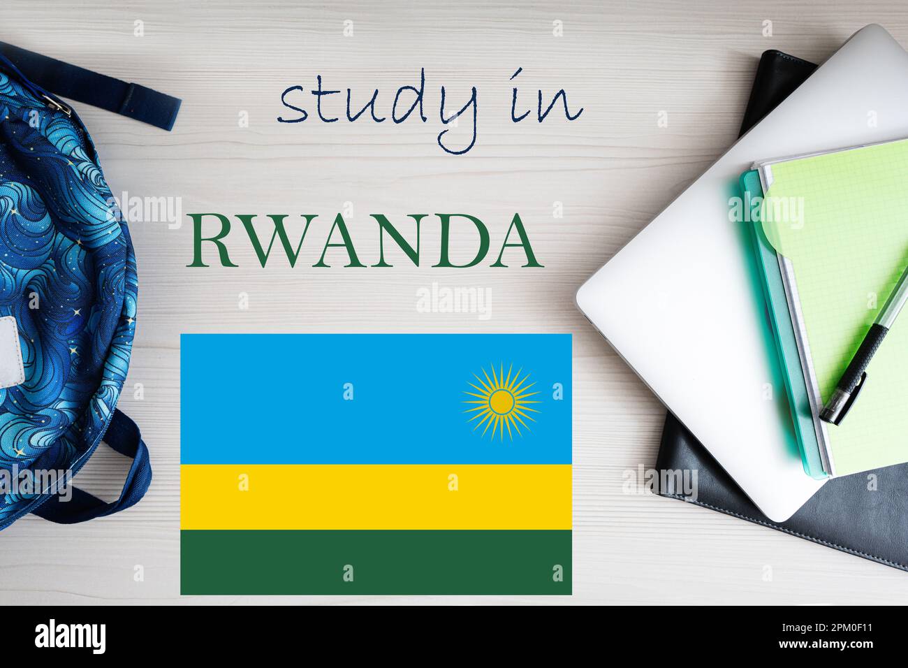 Study in Rwanda. Background with notepad, laptop and backpack ...