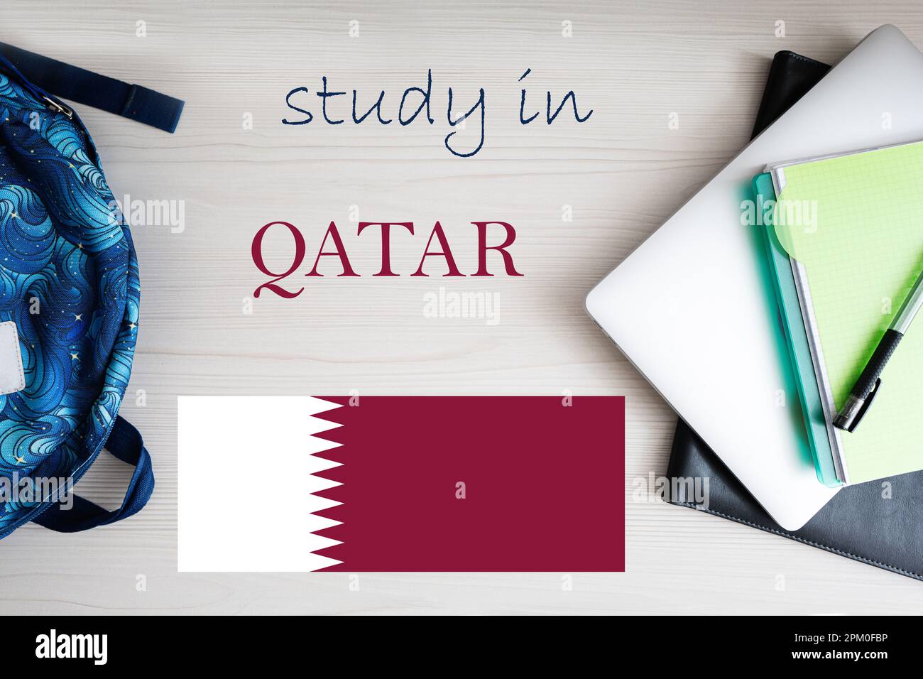 Study in Qatar. Background with notepad, laptop and backpack. Education