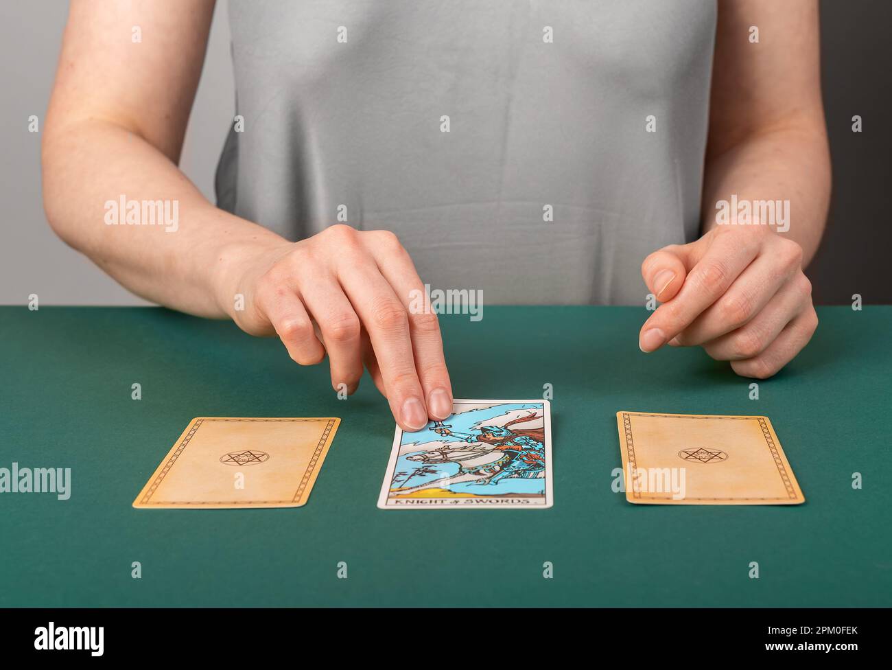 Lodz, Poland April 07 2023 Fortune teller spreading three tarot cards