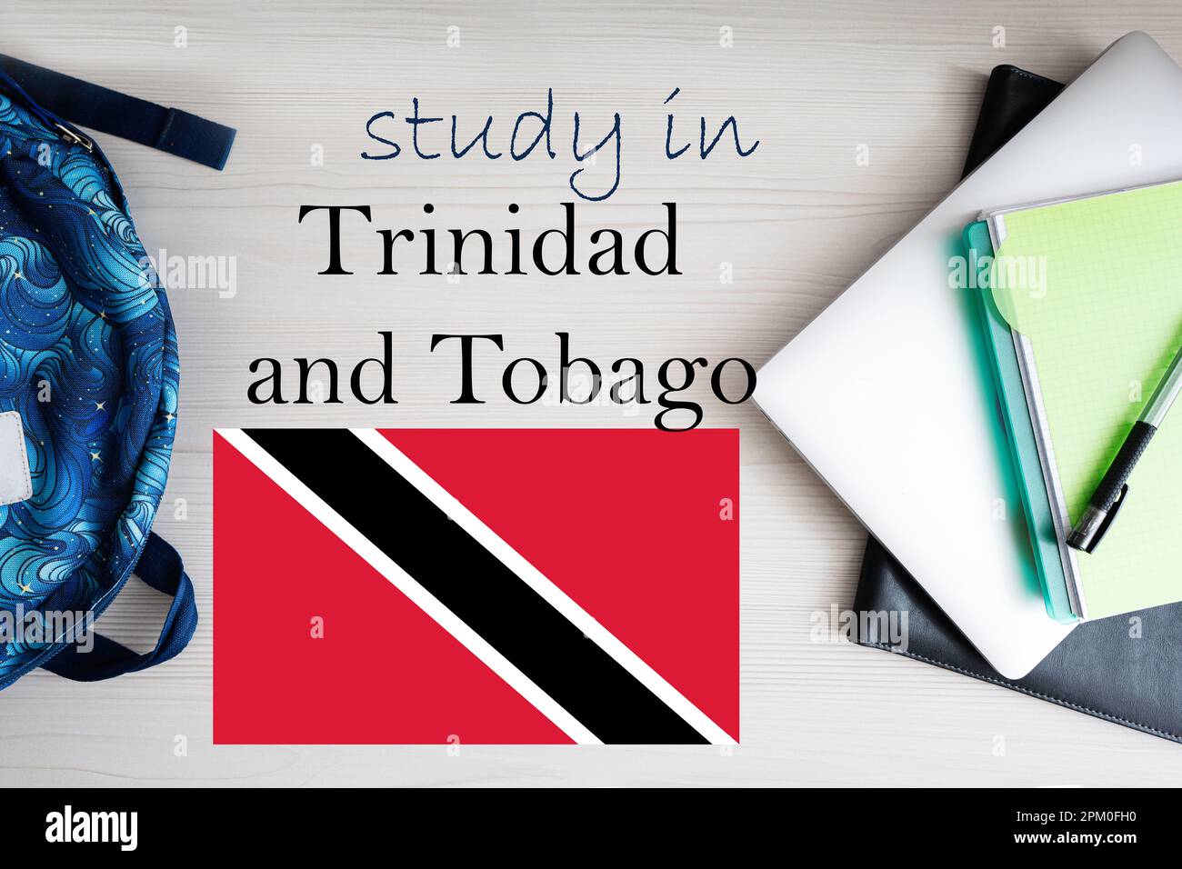 Study in Trinidad and Tobago. Background with notepad, laptop and backpack. Education concept. Stock Photo