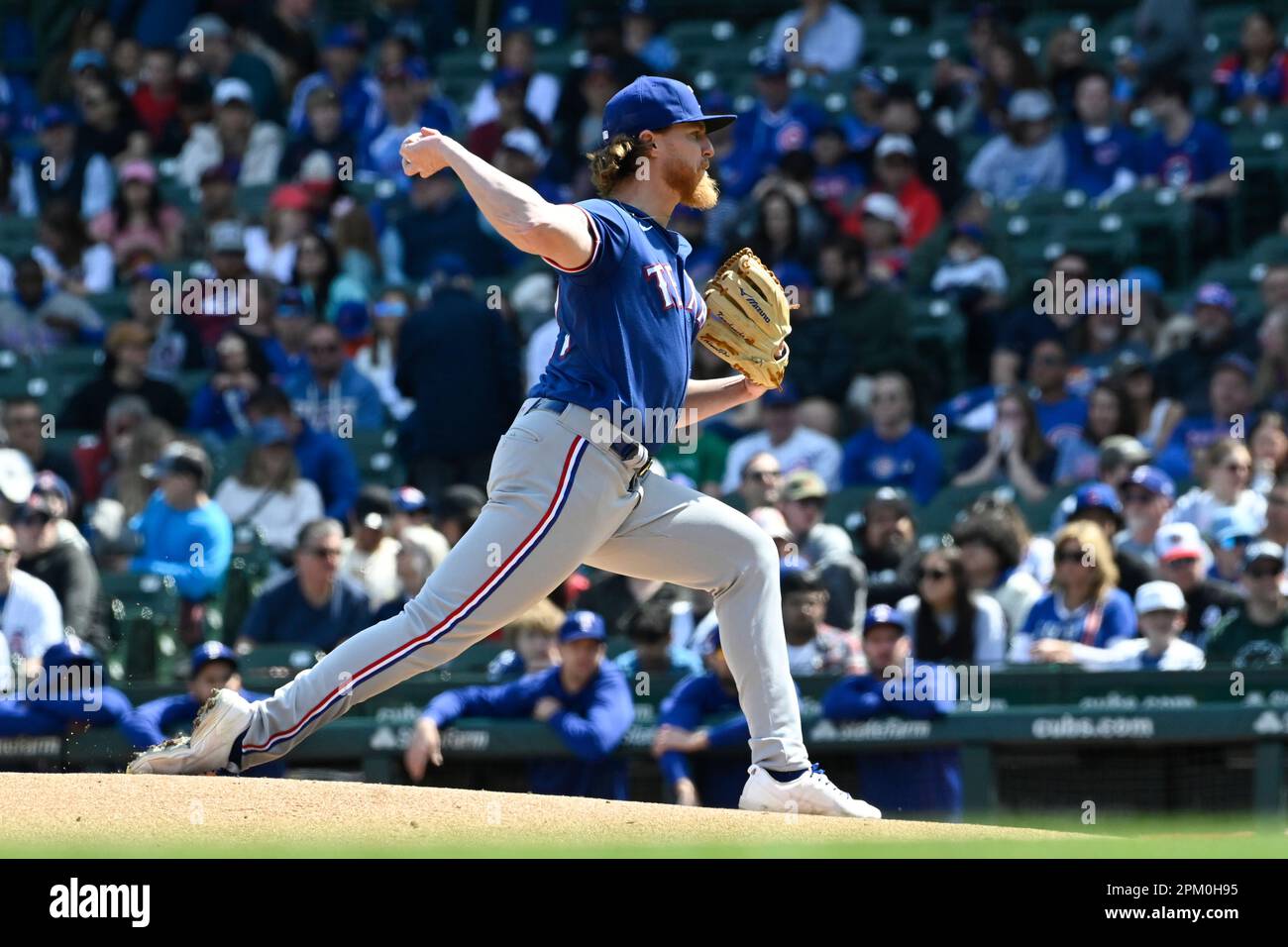 Texas Rangers starting pitcher Jon Gray (22) delivers during the first