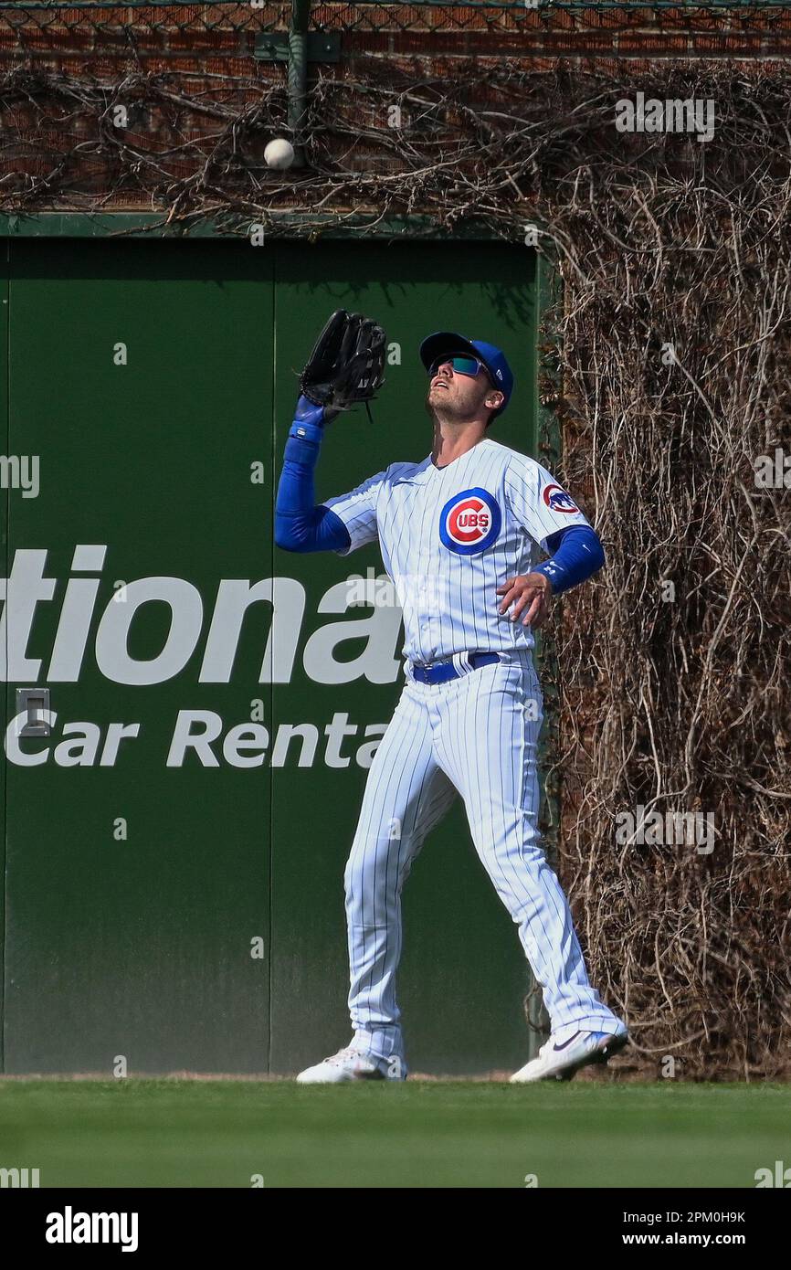 Chicago Cubs center fielder Cody Bellinger catches a fly ball hit by