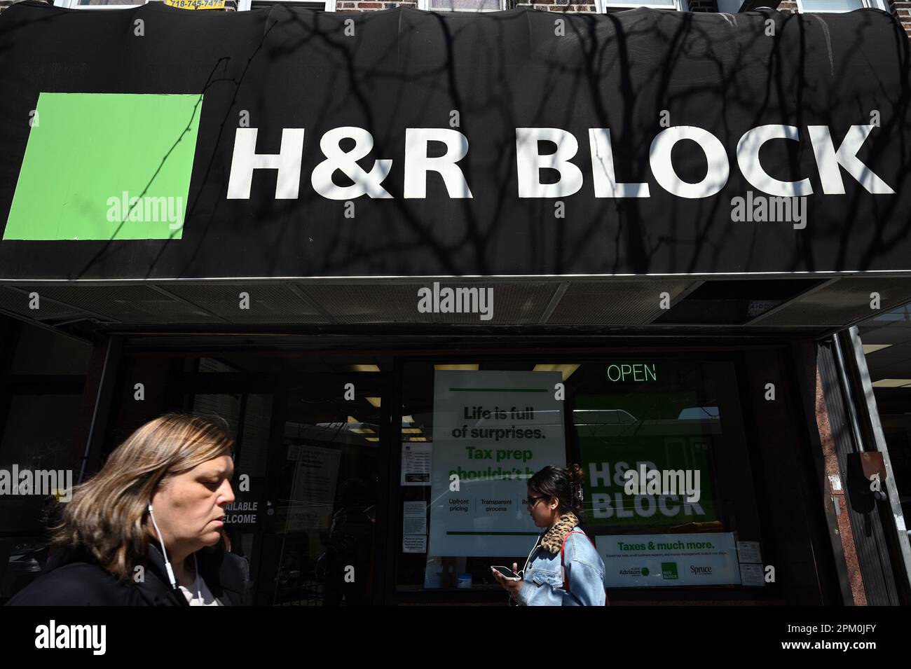 New York, USA. 10th Apr, 2023. People walk past an H&R Block tax ...