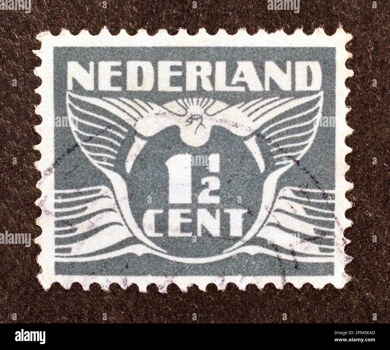 Cancelled postage stamp printed by Netherlands, that shows Numeral value  and image of a flying pigeon, circa 1924 Stock Photo - Alamy