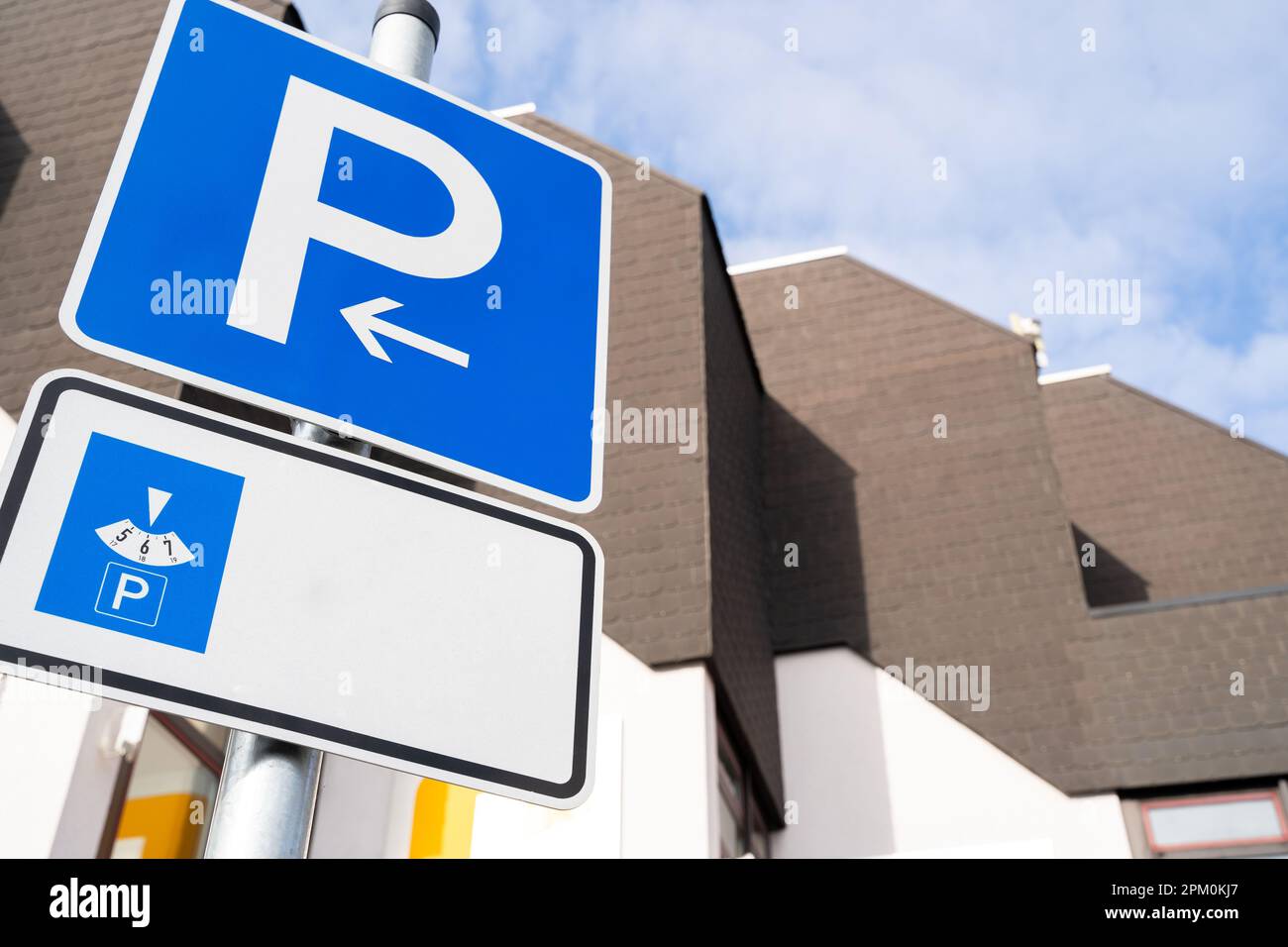 Blue vehicle parking sign with time parking meter and copy space for