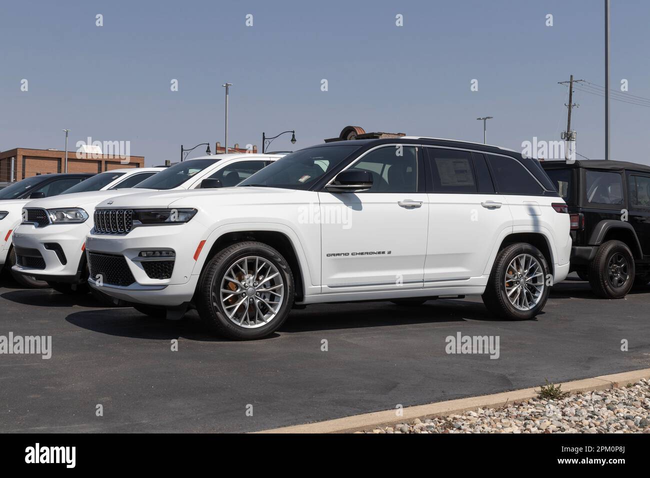 Logansport - Circa April 2023: Jeep Grand Cherokee display at a dealership. Jeep offers the Grand Cherokee in Laredo, Limited, and Trailhawk models. Stock Photo