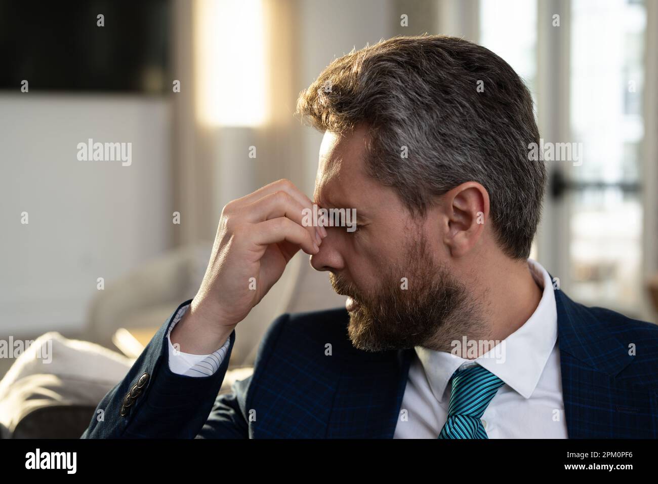 Tired, headache and eye strain from laptop. Businessman with stress