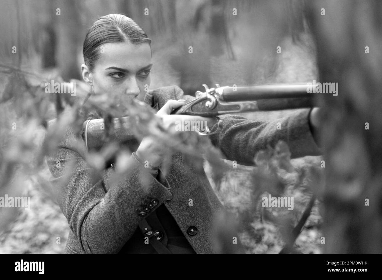 Hunter observing forest. female hunter in forest. successful hunt. hunting sport. woman with weapon. Target shot. military fashion. achievements of Stock Photo
