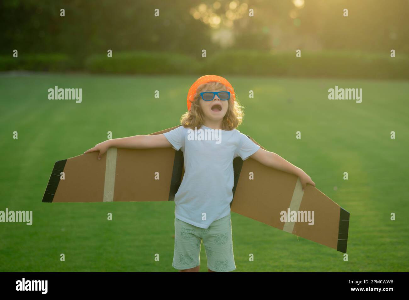 Childhood on countryside. Child boy toddler playing with toy airplane
