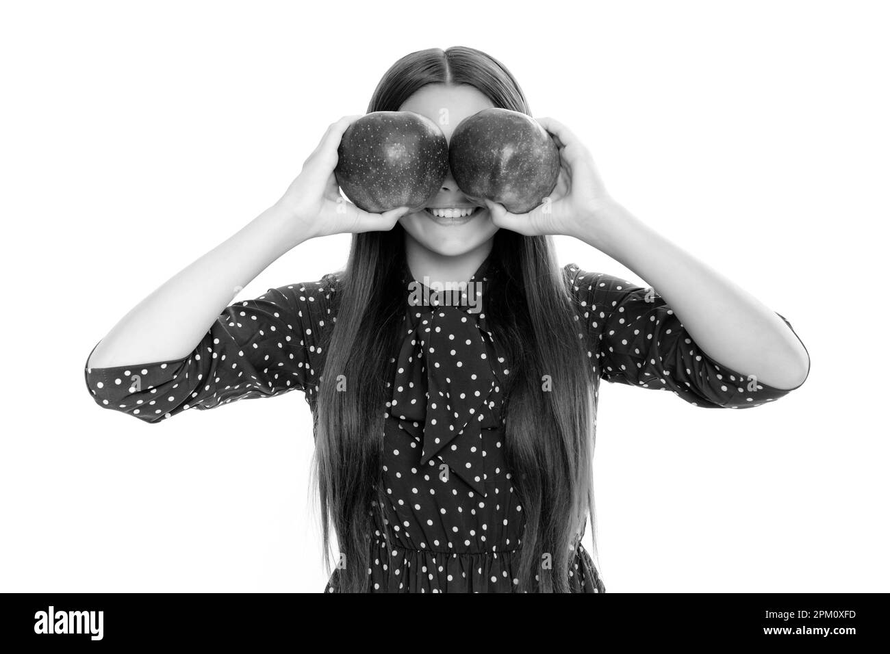 Child girl eating an apple over isolated white background. Apples