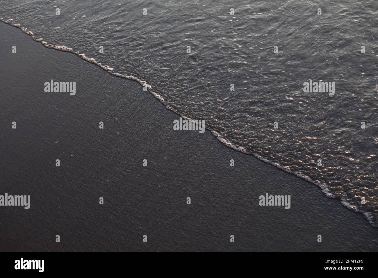 Sea shore during sunset in Lima Peru wet sand Stock Photo