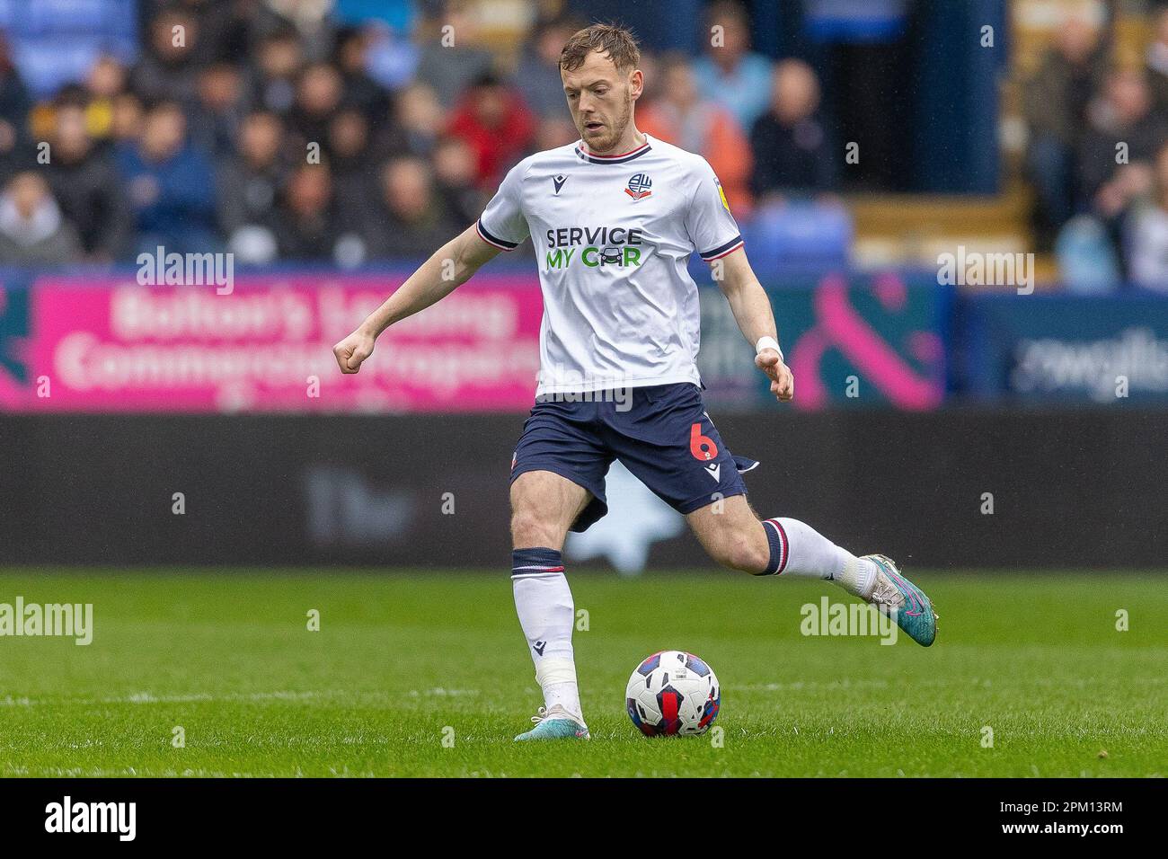 Johnston 6 of Bolton Wanderers passes the ball during the Sky Bet League 1 match Bolton