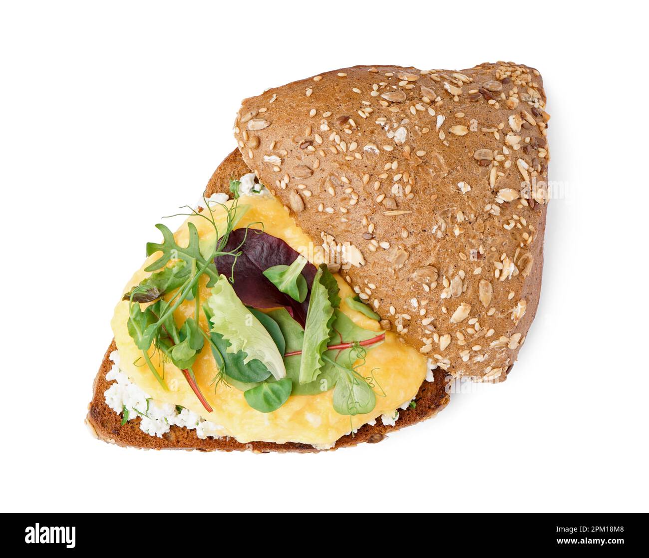 Tasty scrambled eggs sandwich and greens on white background Stock ...