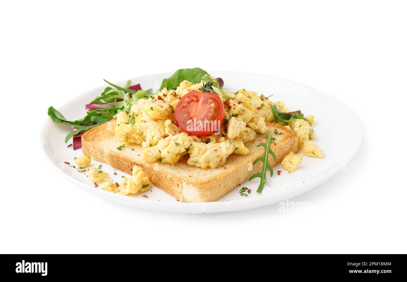 Plate with tasty scrambled eggs sandwich and salad on white background ...