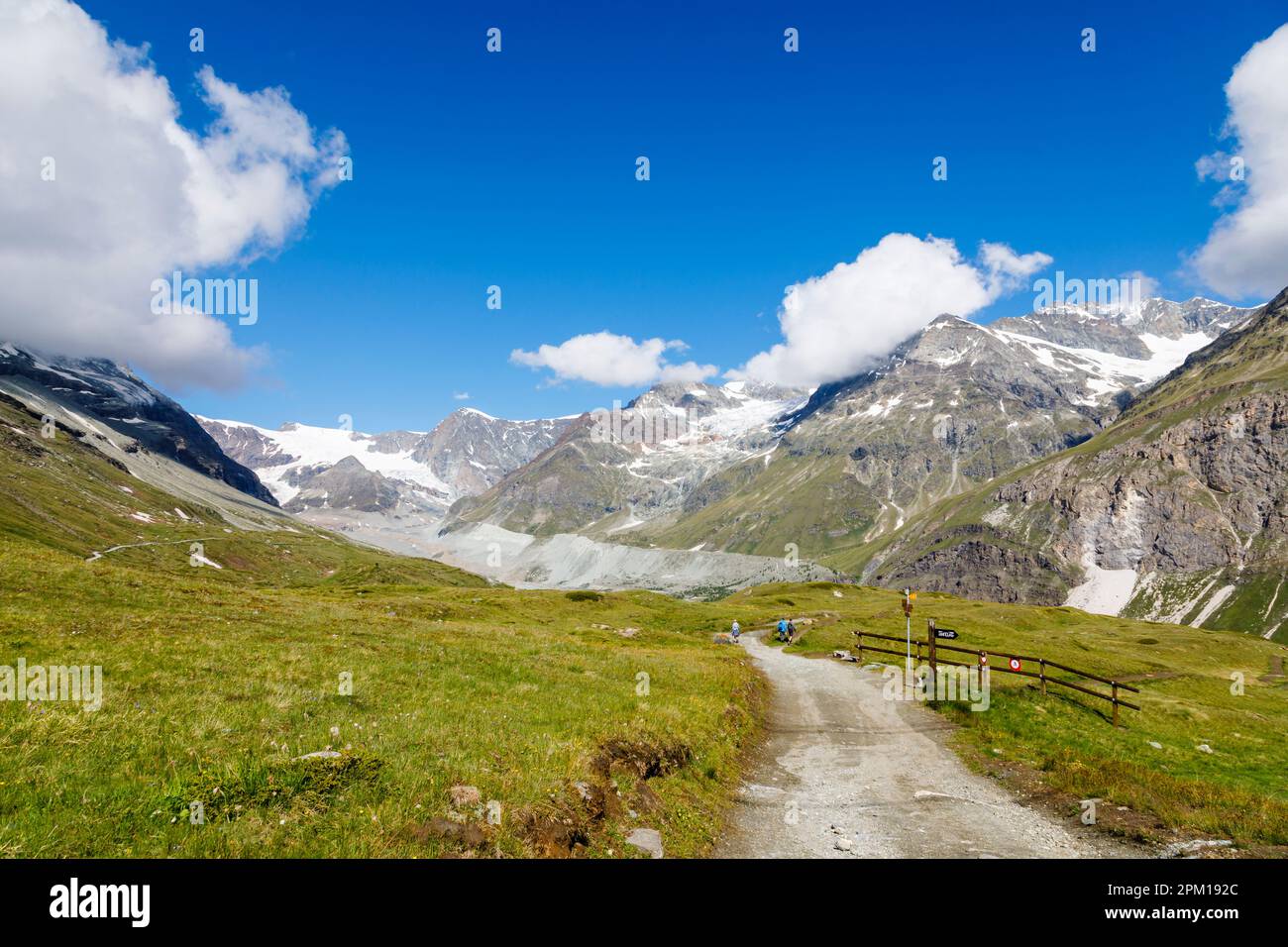 Panoramic mountain view of walking country at Stafelalp on the Matterhorn Trail from Zermatt Schwarzsee above Zermatt on a sunny day with blue sky Stock Photo