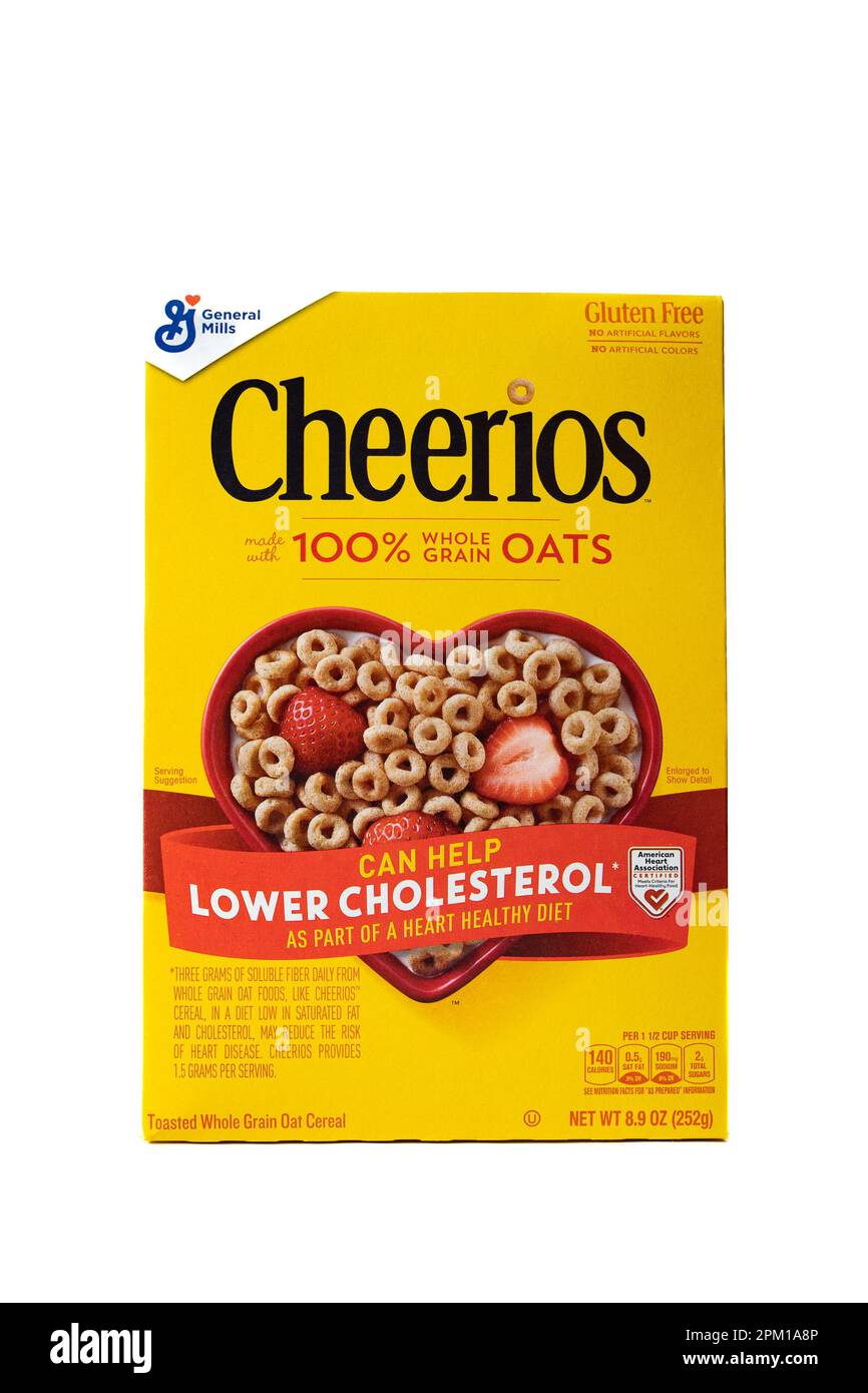 A bright yellow box of General Mills Cheerios, a healthy breakfast cereal made with 100% whole grain oats isolated on a white background Stock Photo