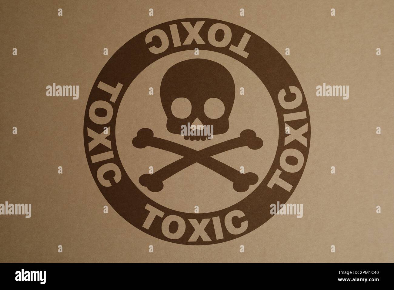 Hazard warning sign (skullandcrossbones symbol and word TOXIC) on