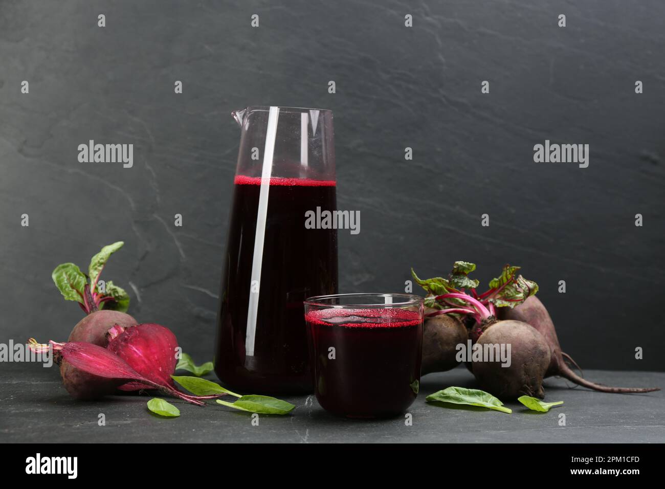 Freshly made beet juice on black table Stock Photo