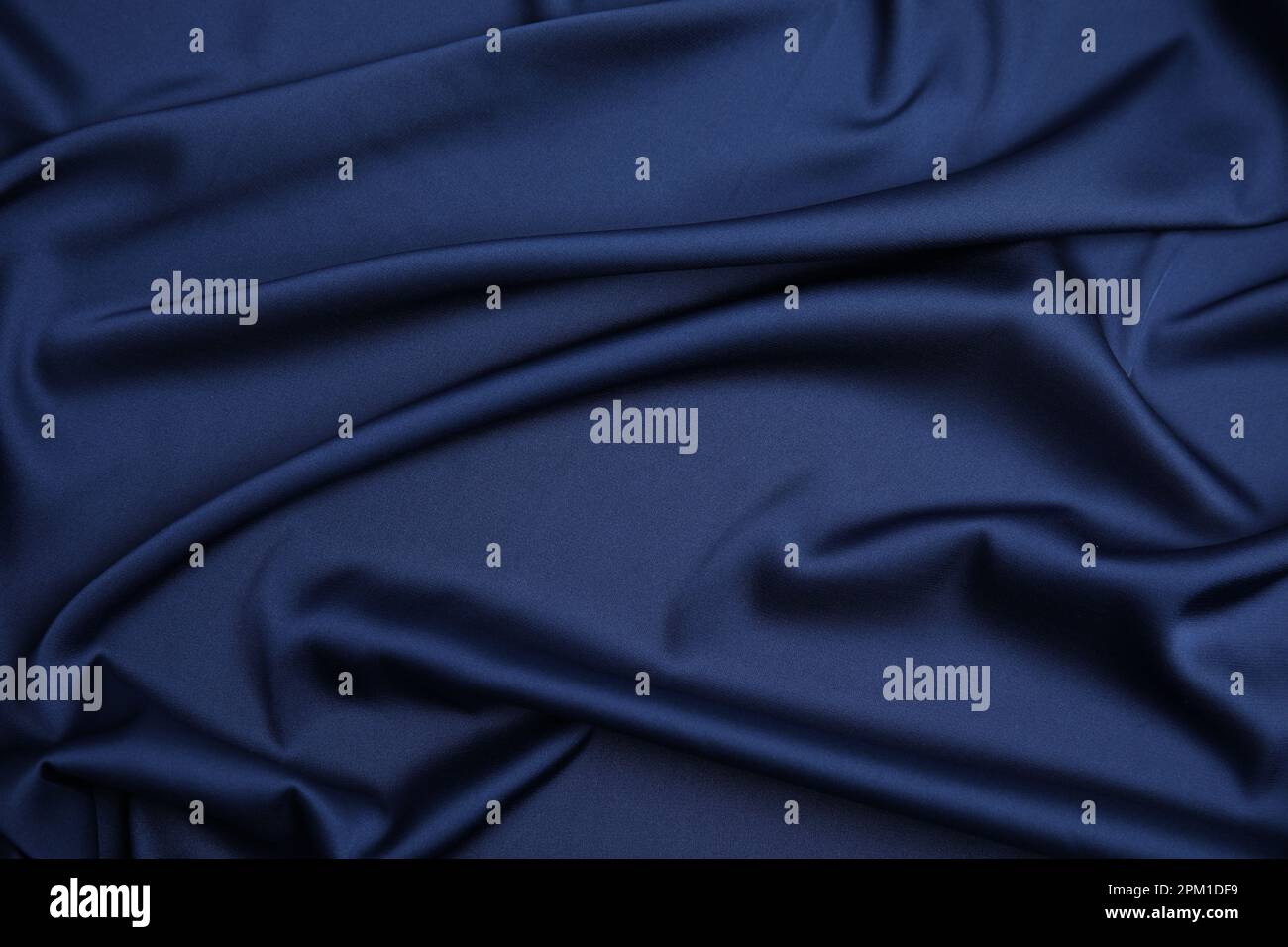 Crumpled dark blue silk fabric as background, top view Stock Photo - Alamy