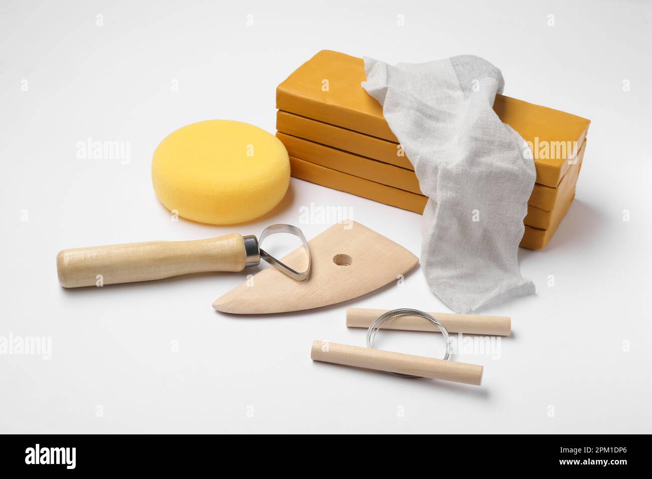 Clay and different modeling tools on white background Stock Photo - Alamy