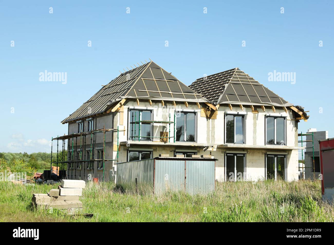Unfinished house under blue sky in countryside Stock Photo - Alamy