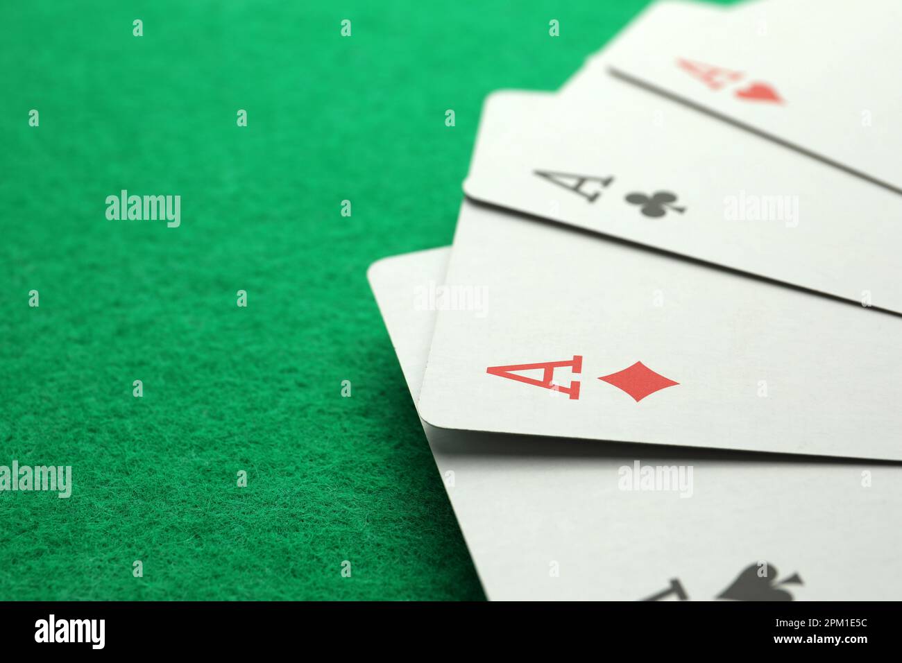 Four aces playing cards on green table. Space for text Stock Photo - Alamy