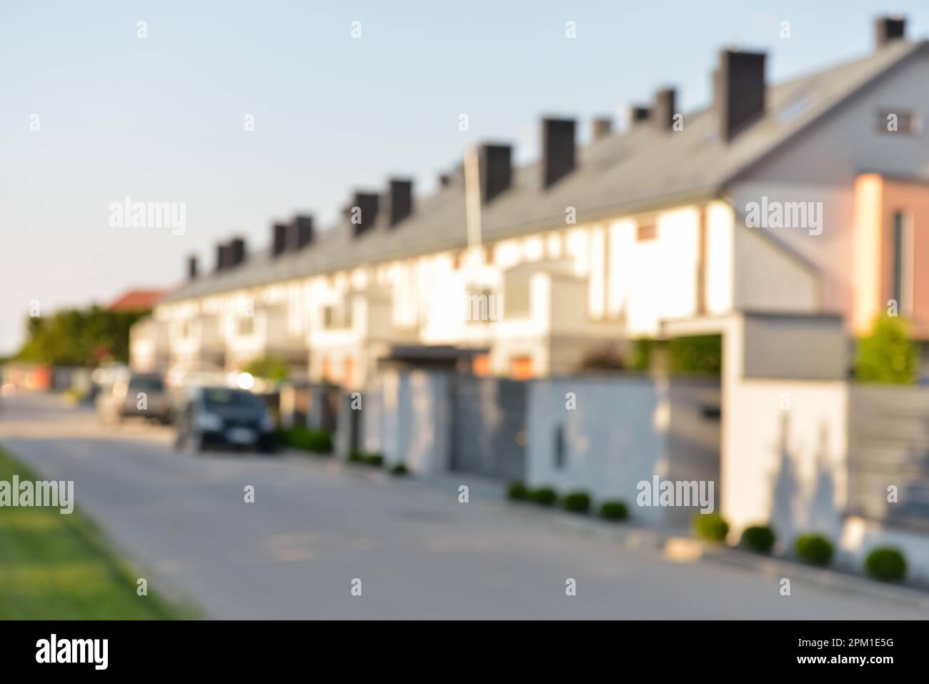 Blurred view of suburban street with beautiful houses Stock Photo - Alamy
