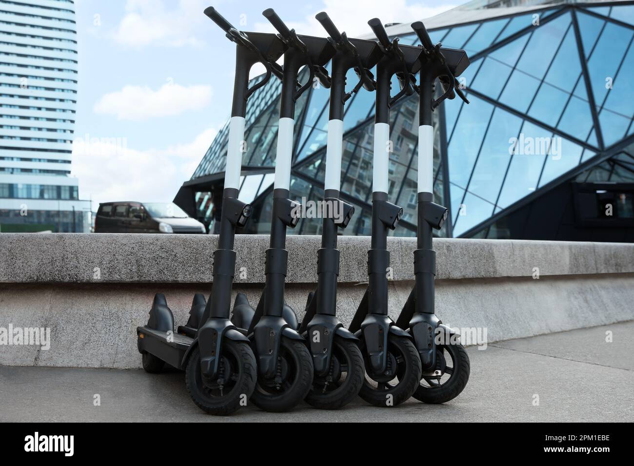 Scooter Rent Building Row of electric scooters on city street. Rental service Stock Photo - Alamy