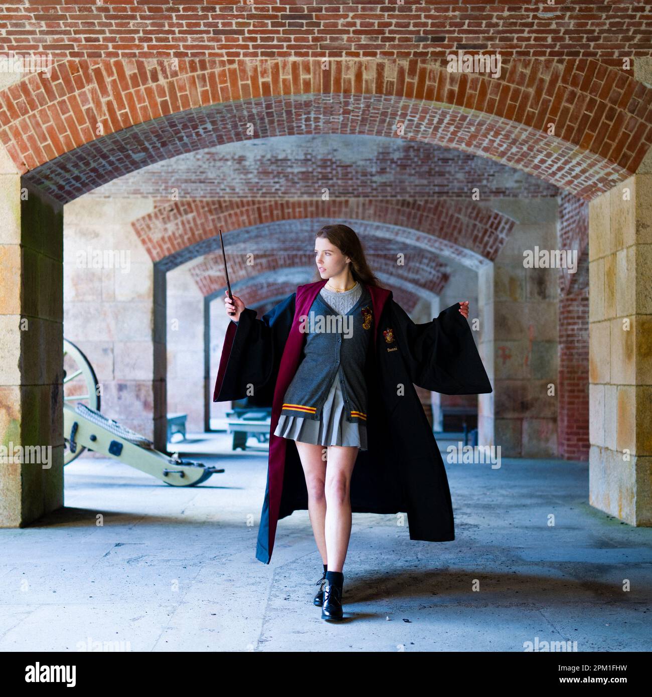 Young Witch Patrolling Fortress Holding Her Wand at the Ready | Harry Potter Stock Photo