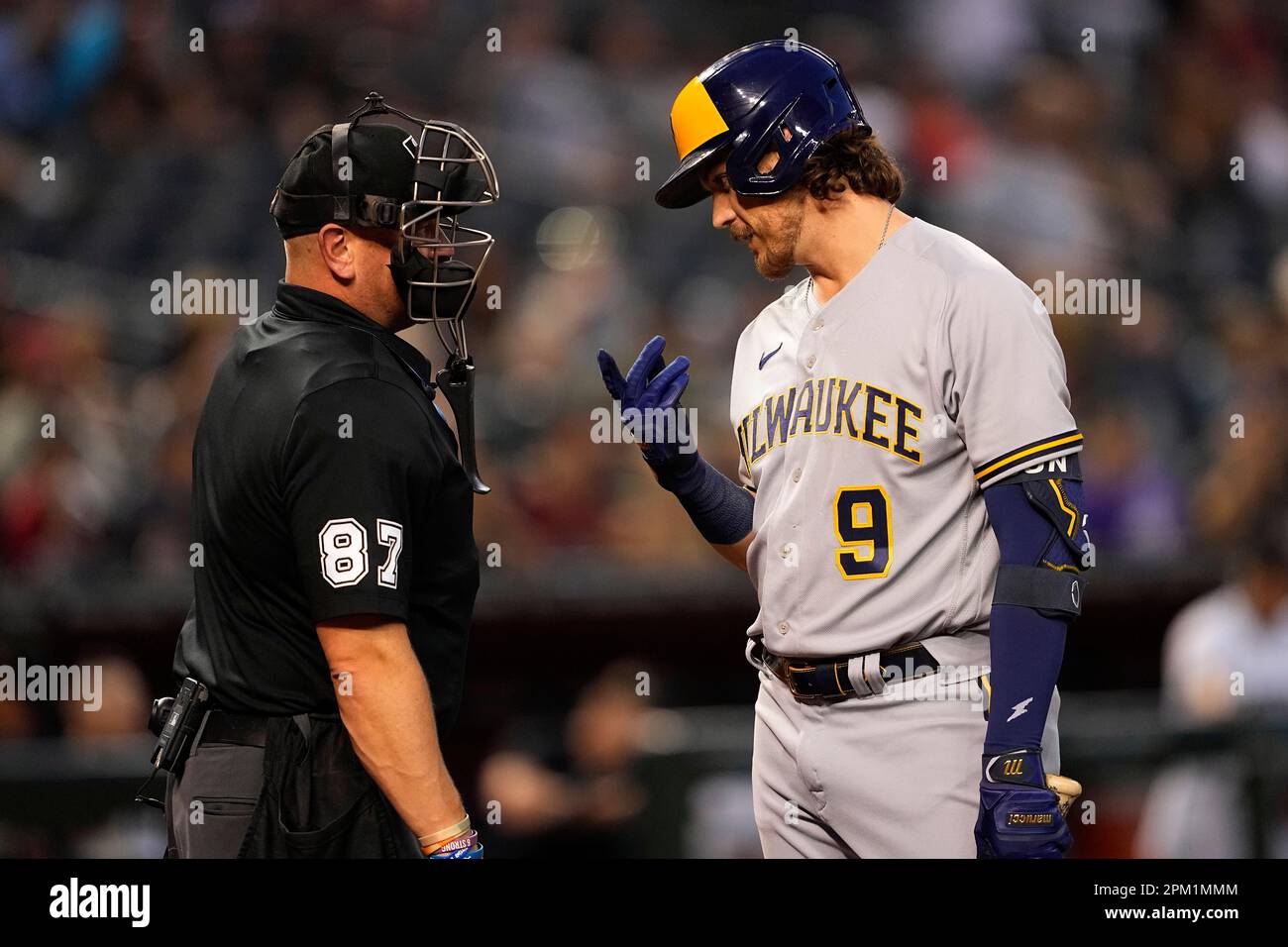 Milwaukee Brewers' Brian Anderson (9) argues a call with home plate umpire  Scott Barry during the second inning of a baseball game against the Arizona  Diamondbacks, Monday, April 10, 2023, in Phoenix. (