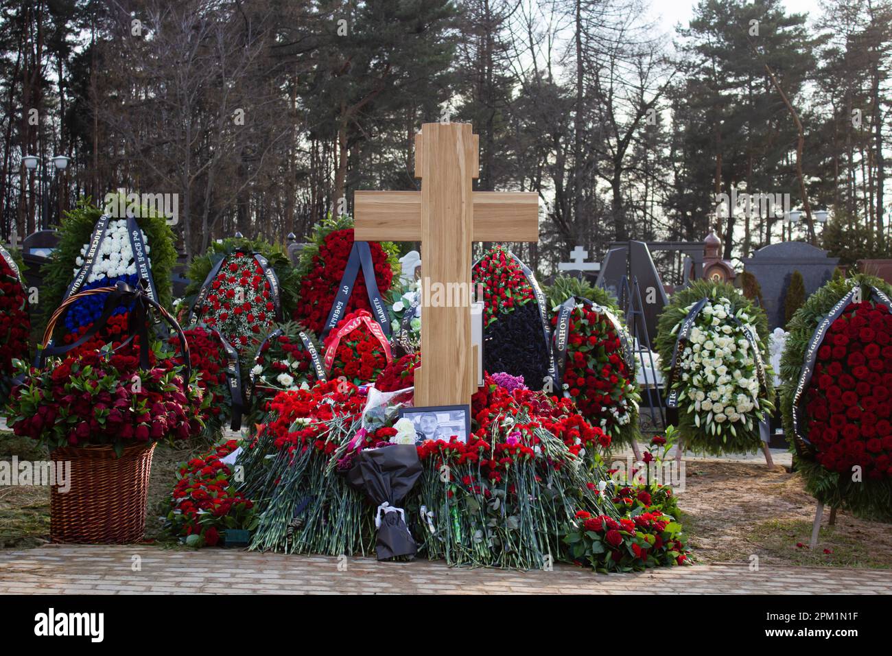 Vladlen Tatarsky's grave seen surrounded by flowers and wreaths at Troyekurovskoye cemetery in Moscow. Maxim Fomin better known by his pen-name Vladlen Tatarsky was a convicted criminal who escaped from prison and made a name for himself as a Ukrainian-born Russian military blogger and a participant in the war between Russian and Ukraine. He was active as a propagandist for the Russian side in the war until he was murdered in a terrorist act in St. Petersburg on April 2, 2023. 26-year-old woman named Darya Trepova was arrested for the bombing that had killed Tatarsky and injured dozens of othe Stock Photo