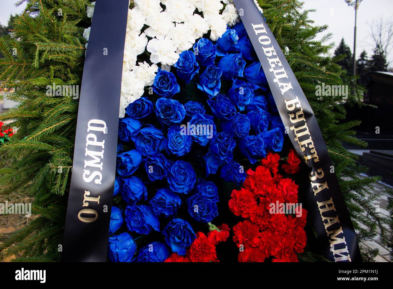 A funeral wreath is seen on the grave of Vladlen Tatarsky and the text reads: 'Victory will be ours' at Troyekurovskoye cemetery in Moscow. Maxim Fomin better known by his pen-name Vladlen Tatarsky was a convicted criminal who escaped from prison and made a name for himself as a Ukrainian-born Russian military blogger and a participant in the war between Russian and Ukraine. He was active as a propagandist for the Russian side in the war until he was murdered in a terrorist act in St. Petersburg on April 2, 2023. 26-year-old woman named Darya Trepova was arrested for the bombing that had kille Stock Photo