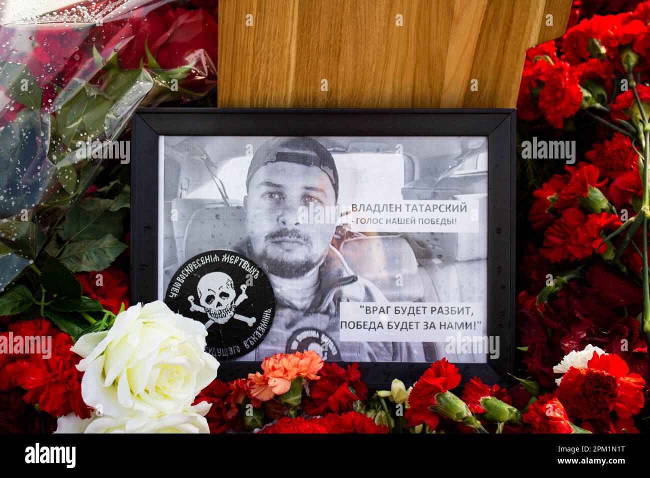 A framed photo of Vladlen Tatarsky at his grave at Troyekurovskoye cemetery in Moscow. Maxim Fomin better known by his pen-name Vladlen Tatarsky was a convicted criminal who escaped from prison and made a name for himself as a Ukrainian-born Russian military blogger and a participant in the war between Russian and Ukraine. He was active as a propagandist for the Russian side in the war until he was murdered in a terrorist act in St. Petersburg on April 2, 2023. 26-year-old woman named Darya Trepova was arrested for the bombing that had killed Tatarsky and injured dozens of others. Stock Photo
