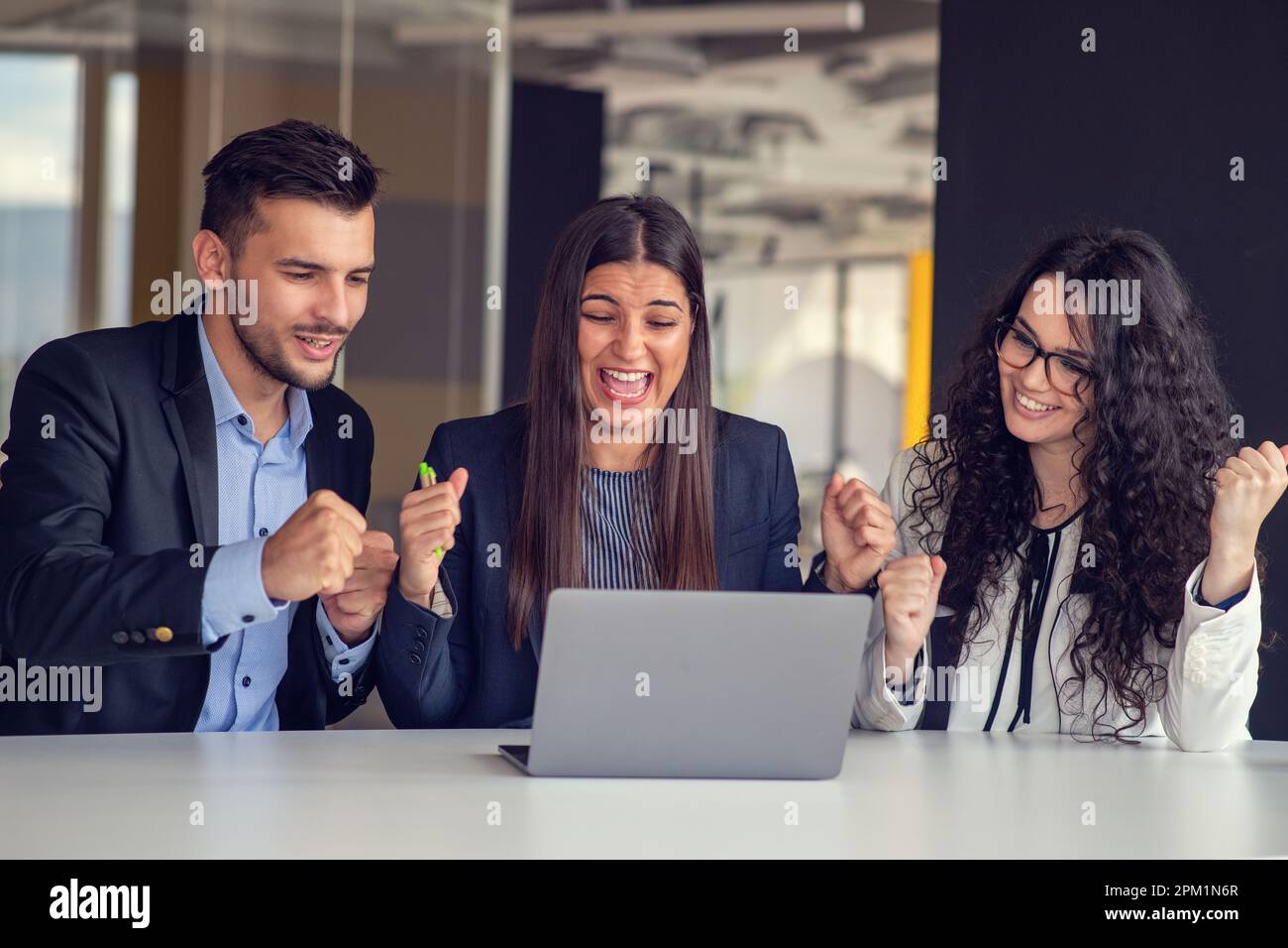 Focused startup team using laptops hi-res stock photography and images ...