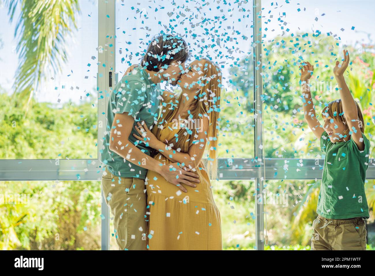 It's a boy. Expectant parents mother, father and their elder son are ...