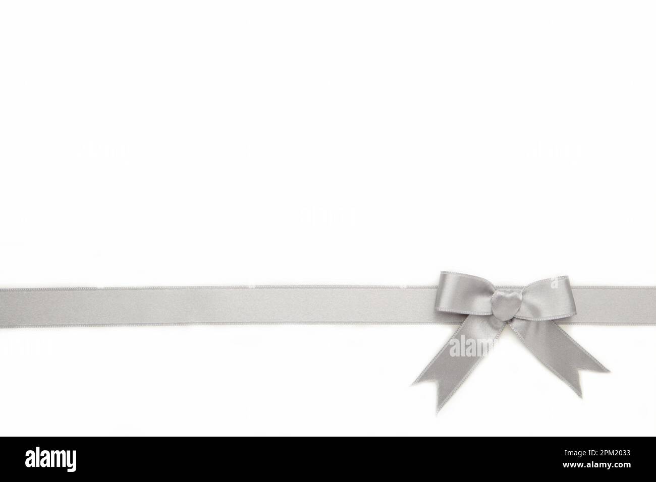 Silver ribbon and bow isolated on white background. Top view Stock ...