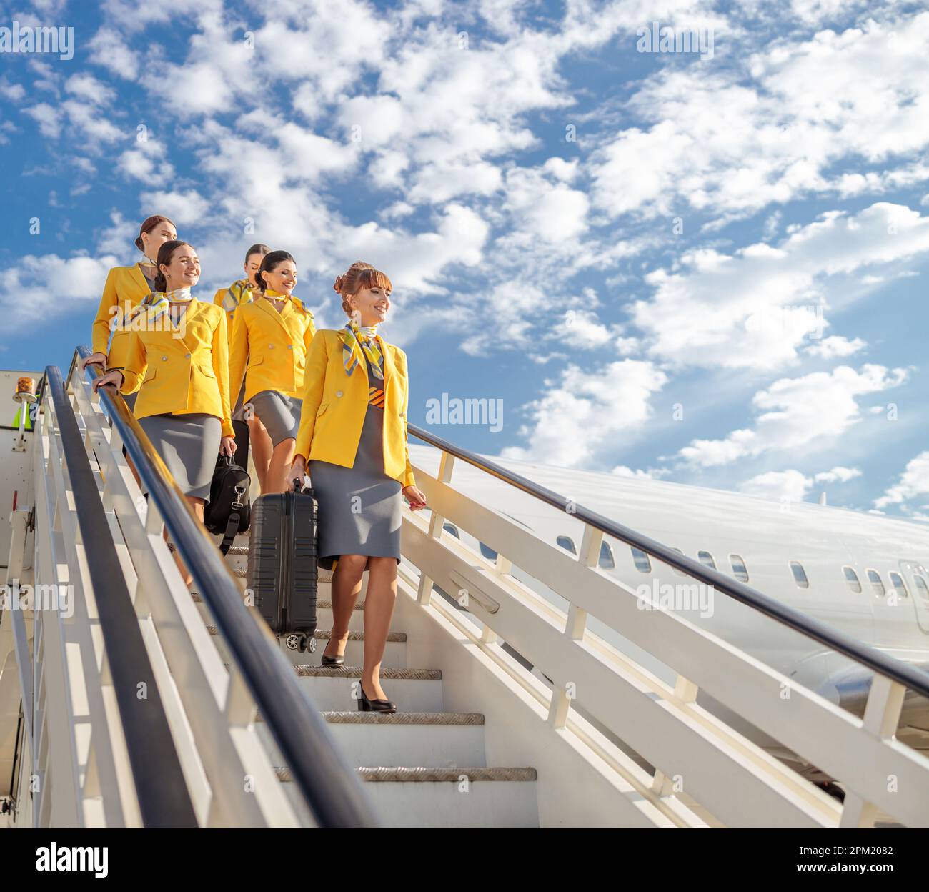 Walking down plane stairs hi-res stock photography and images - Alamy