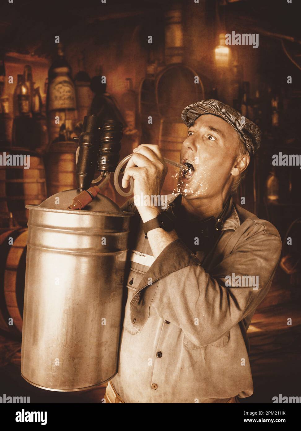 Humorous portrait on a distillery man filling the tank with a hard bootleg beverage Stock Photo